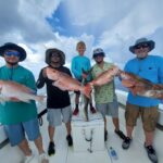Werefillingcoolerswithgroupersnapperonourdeepseacharters[1]