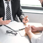 Business,people,negotiating,a,contract.,human,hands,working,with,documents